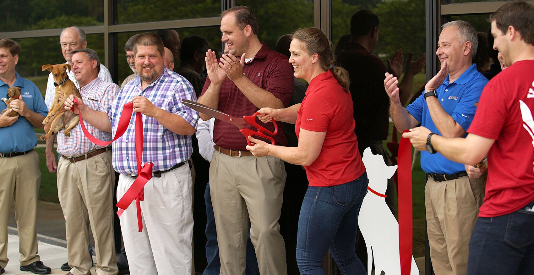Group of people at ribbon cutting ceremony